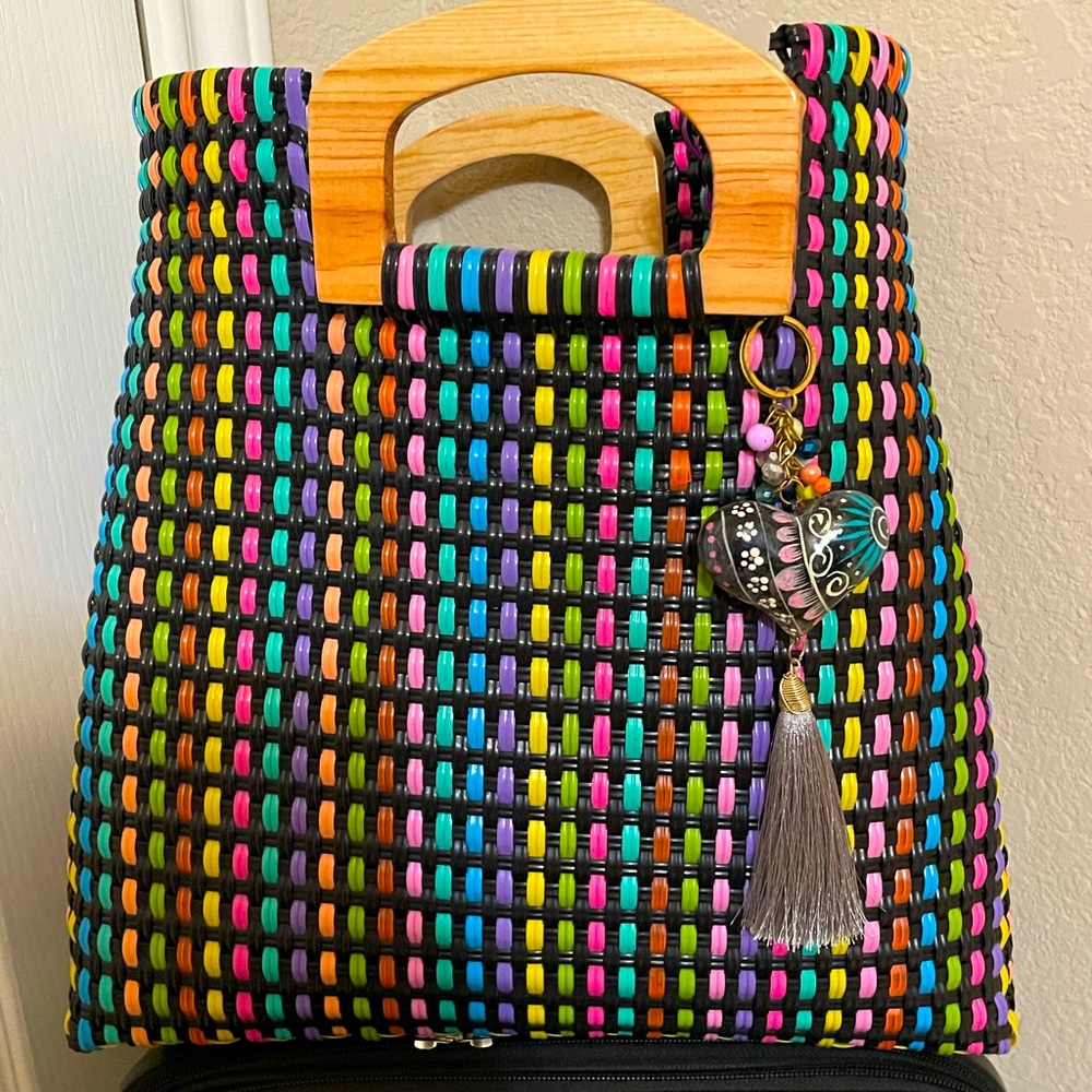 Beautiful Artisan multi colored purse with wood handle.